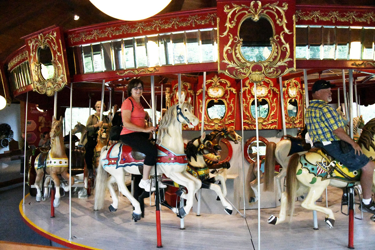 082 Connie Nickel rode the 1908 carousel at Heritage Plantation. Ron Nickel is ahead to the right..jpg